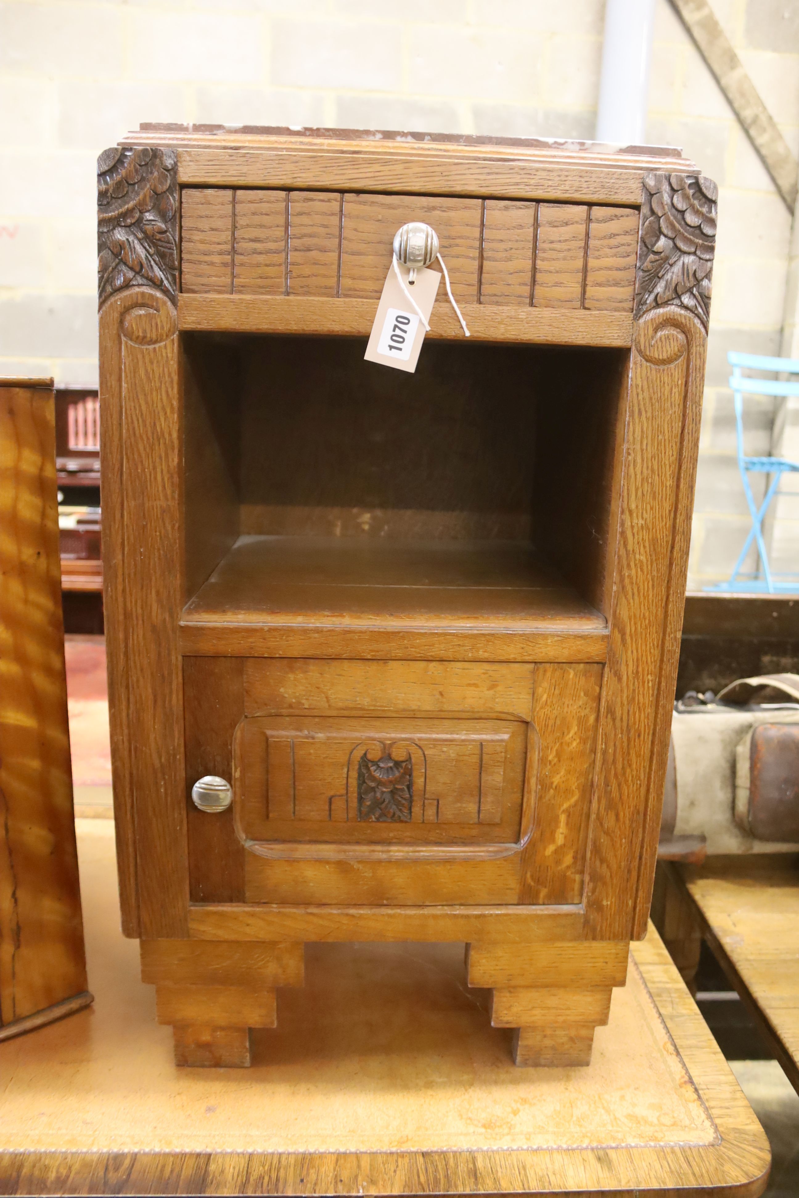 A 1930's French oak marble top bedside cabinet, width 42cm, depth 38cm, height 73cm